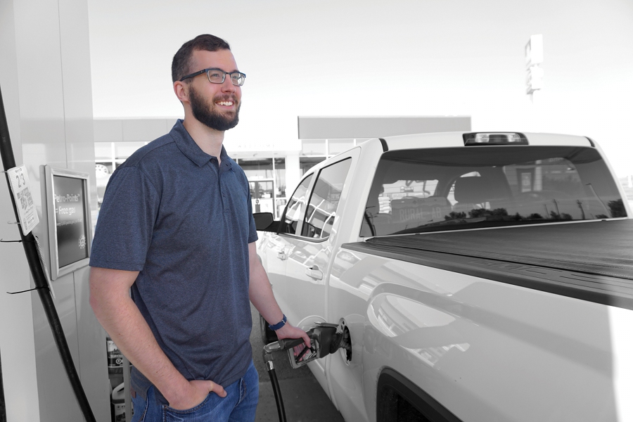 A man fills his truck with gasoline