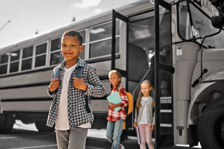 Children walking off a school bus